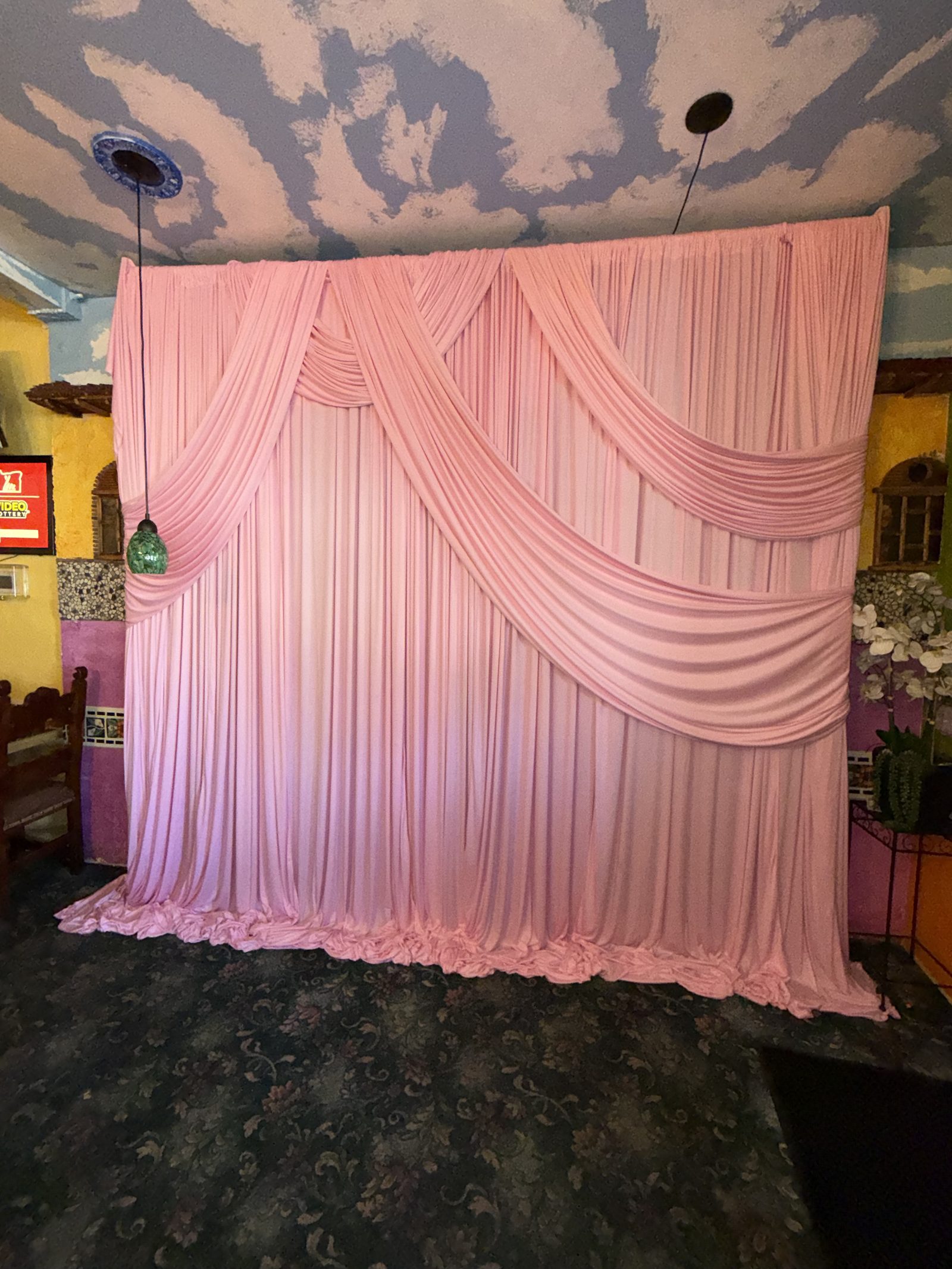 Pink backdrop installation — Brow Society lash studio event, Salem OR